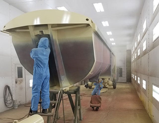 Workers Finishing A Trailer